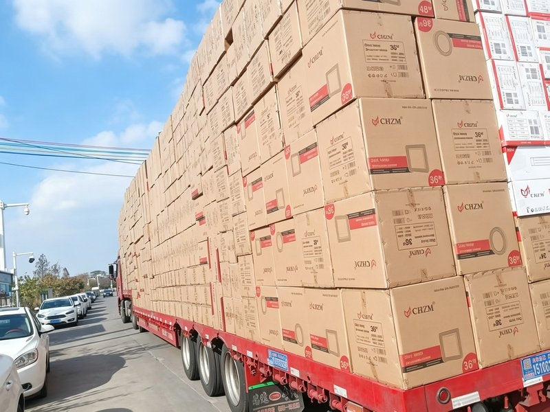 CHZM cartons loaded on trailer for container transport